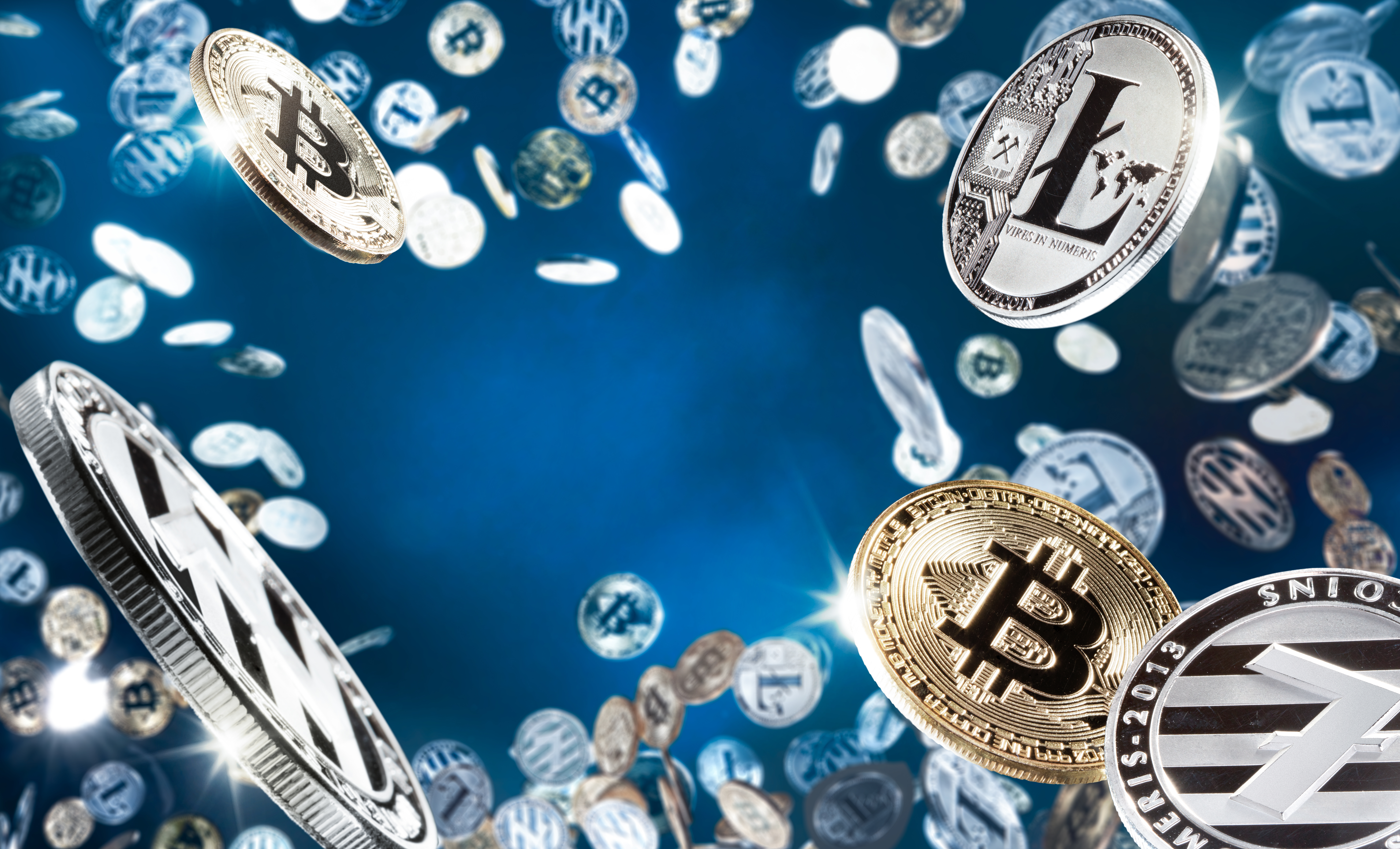 Hand,Holding,Mobile,Tablet,With,Stack,Of,Bitcoin,Coins,Against - Tokenhell Tradingem Group cryptocurrency trading