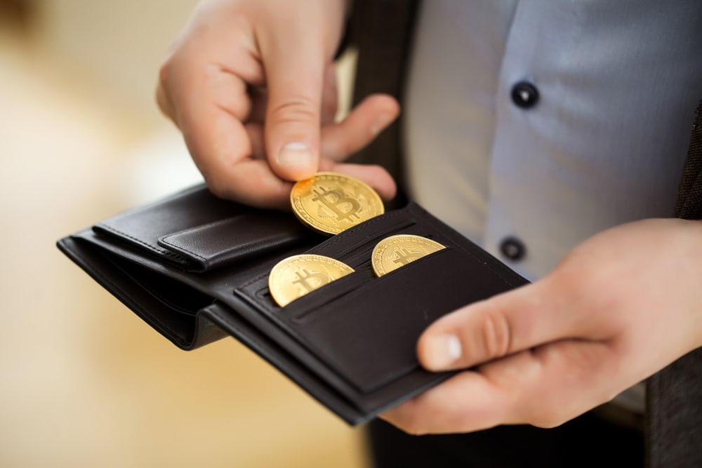 Businessman,Holding,Bitcoin.golden,Bitcoin,Coins,In,Man,Hands.,Virtual,Currency. - Tokenhell