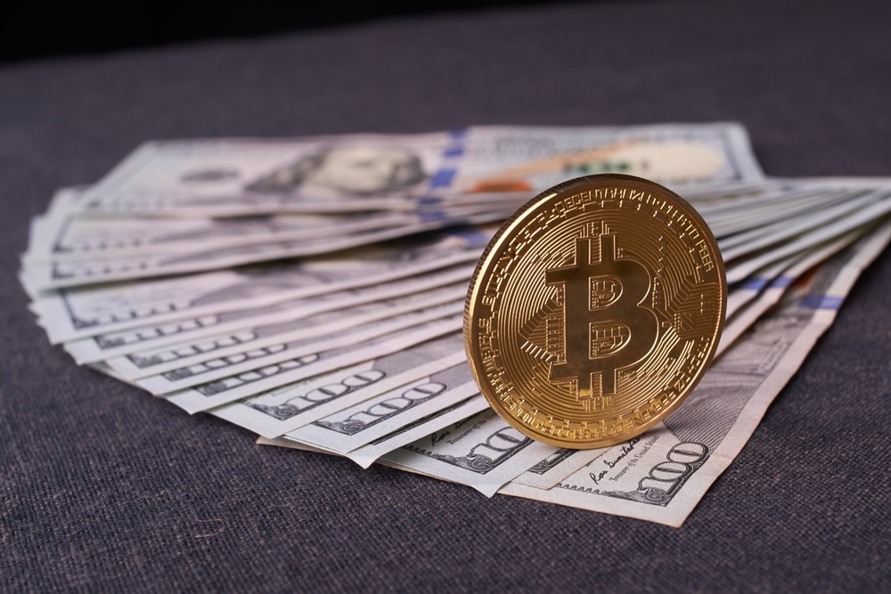 Golden,Metal,Bitcoin,On,Dollar,Bills,Background.,A,Lot,Of - Tokenhell
