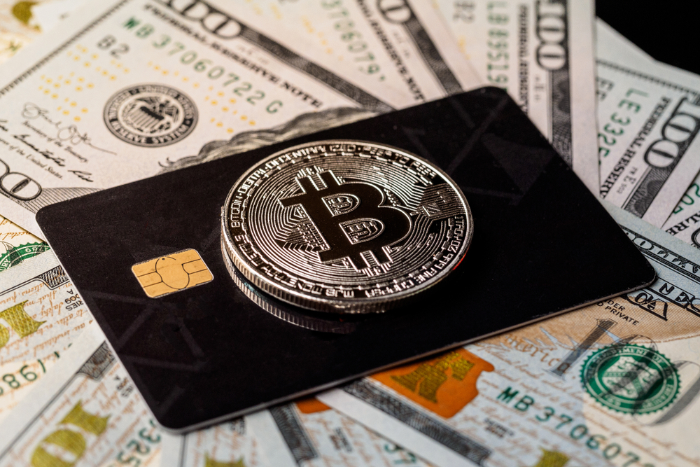 Silver,Bitcoin,With,Credit,Card,On,Top,Of,Dollars,Banknote - Tokenhell