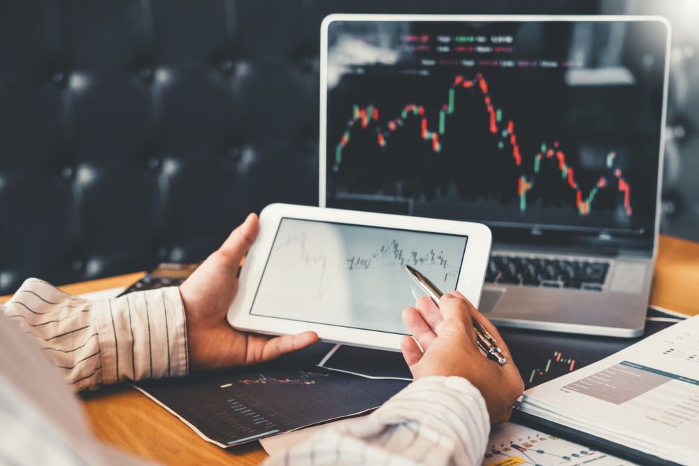 Investment,Stock,Market,Entrepreneur,Business,Man,Using,Tablet,Discussing,And - Tokenhell