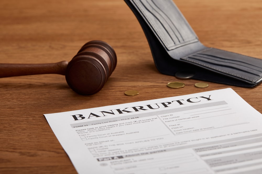 Bankruptcy,Form,With,Wooden,Gavel,,Coins,And,Wallet,On,Brown - Tokenhell