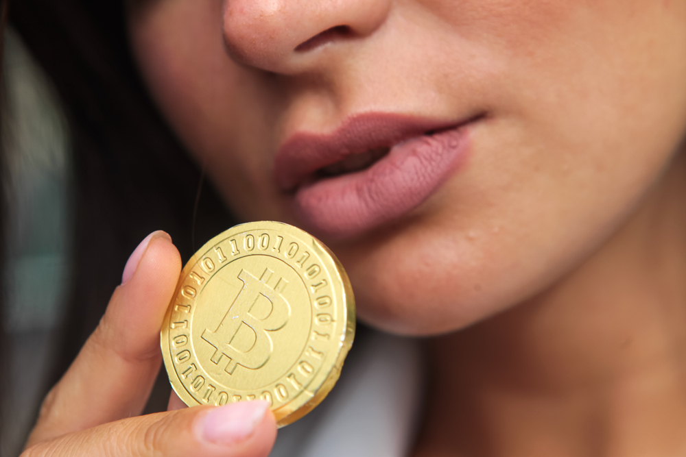Bitcoins.,A,Beautiful,Girl,Holds,A,Bitcoin,Coin,Near,Her - Tokenhell