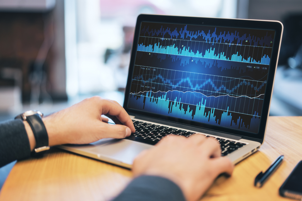 Close,Up,Of,Man,Hands,Using,Laptop,With,Empty,White - Tokenhell Tigersfm cryptocurrency trading