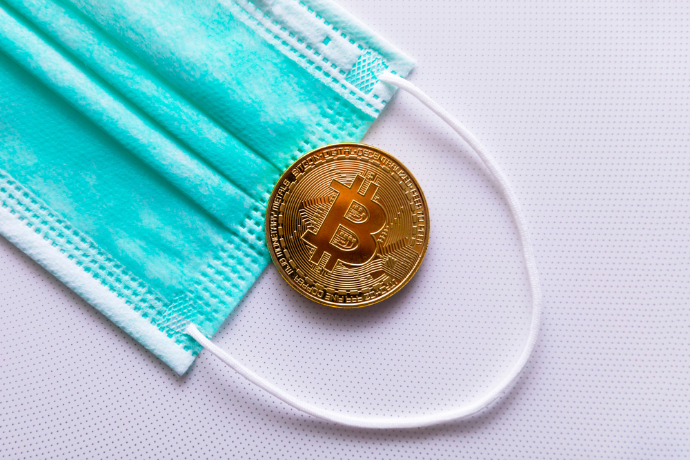 Protective,Medical,Mask,And,Bitcoin,Close-up.,The,Concept,Of,The - Tokenhell