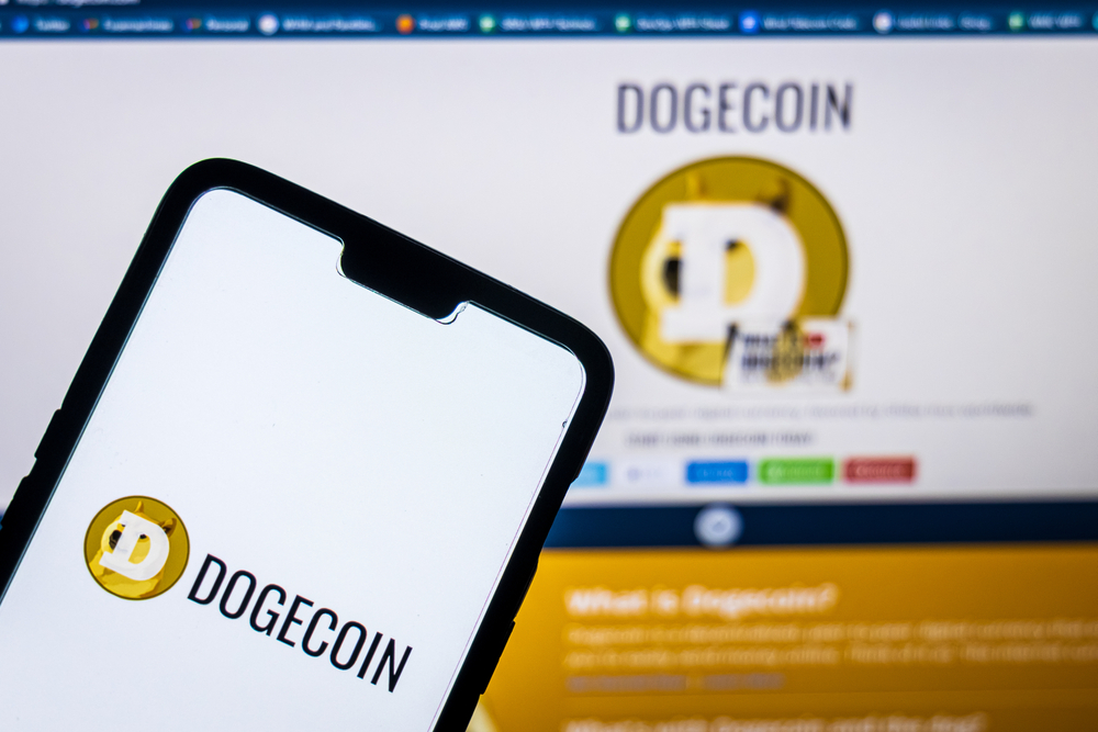 Dogecoin,Logo,On,A,Smartphone,Against,Dogecoin,Website,In,The - Tokenhell
