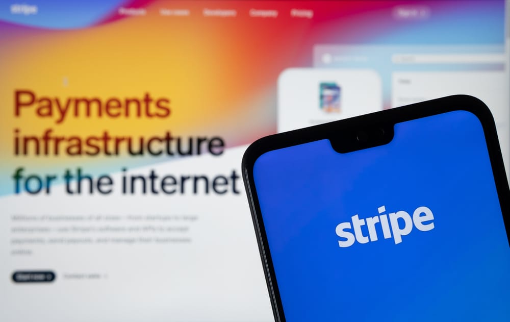 StripePaymentProviderLogoSeenOnTheSmartphoneAndStripe - Tokenhell