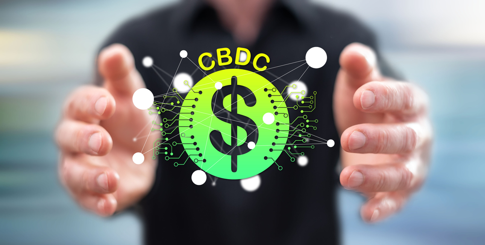 Cbdc,Concept,Between,Hands,Of,A,Man,In,Background - Tokenhell