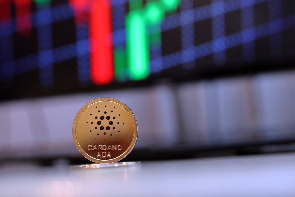 Ada,Cardano,Coin,Sitting,On,A,Desk,With,A,Red - Tokenhell