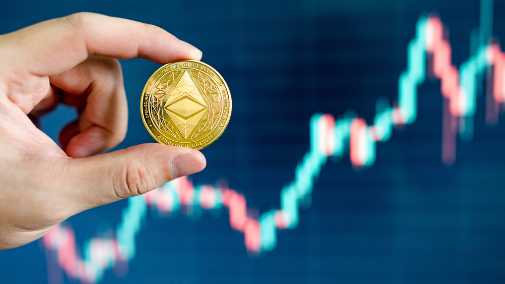 Hand,Holding,Gold,Eth,Coin,With,Blurred,Candlestick,Chart,In - Tokenhell