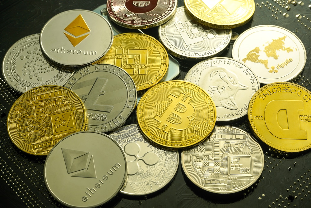 Stack,Of,Cryptocurrencies,,Golden,Coins,With,Bitcoin,Symbol,On,A - Tokenhell