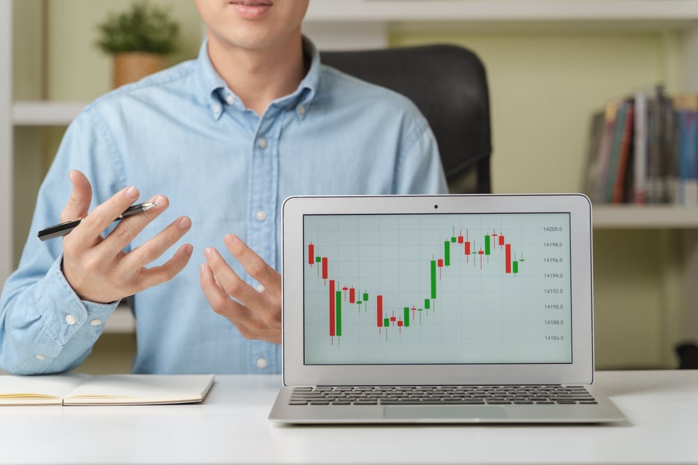 Young,Attractive,Businessman,Or,Investor,Teaching,In,Online,Investing,Courses - Tokenhell