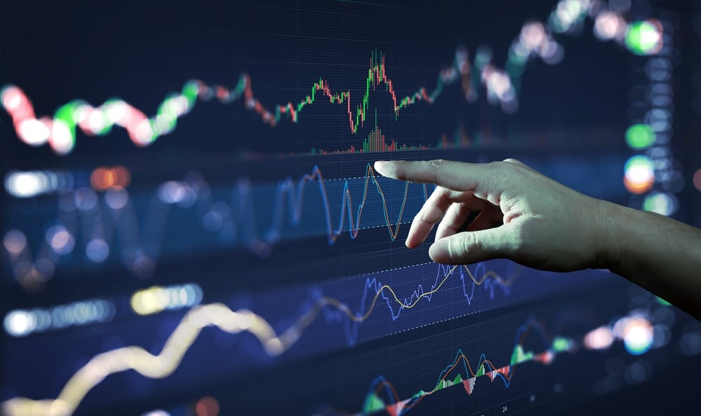 BusinessmanHandAnalysingFinancialStockMarketGraphOnBoardTrading - Tokenhell ISA-Limited Review: A Clear Analysis Of Its Services