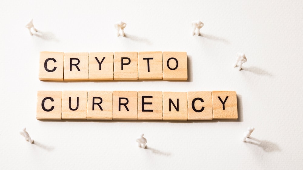 MiniatureWhiteFiguresWithShadowMeetingOnCryptoCurrency - Tokenhell PENGU: All You Need to Know About the Pudgy Penguins Solana-Based Token