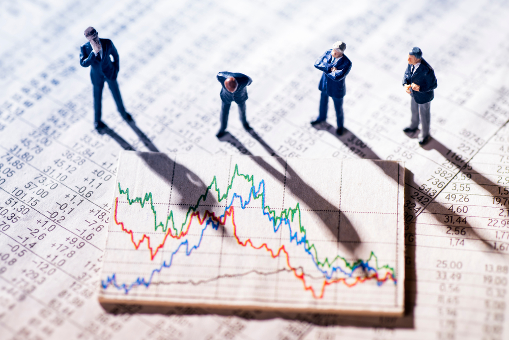 Businessmen,Are,Skeptical,Looking,At,Stock,Market,Charts. - Tokenhell