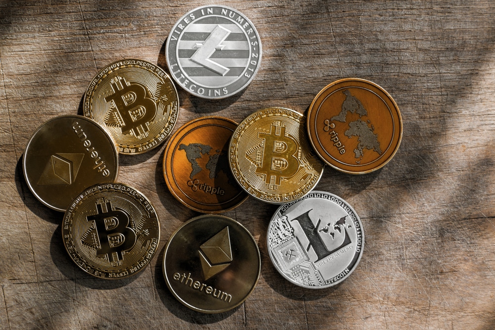 Family,Of,Cryptocurrency.,Stack,Of,Shining,Golden,And,Silver,Coins - Tokenhell